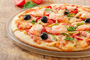 Pizza with Shrimp, Zucchini, Peppers and Olives Photo